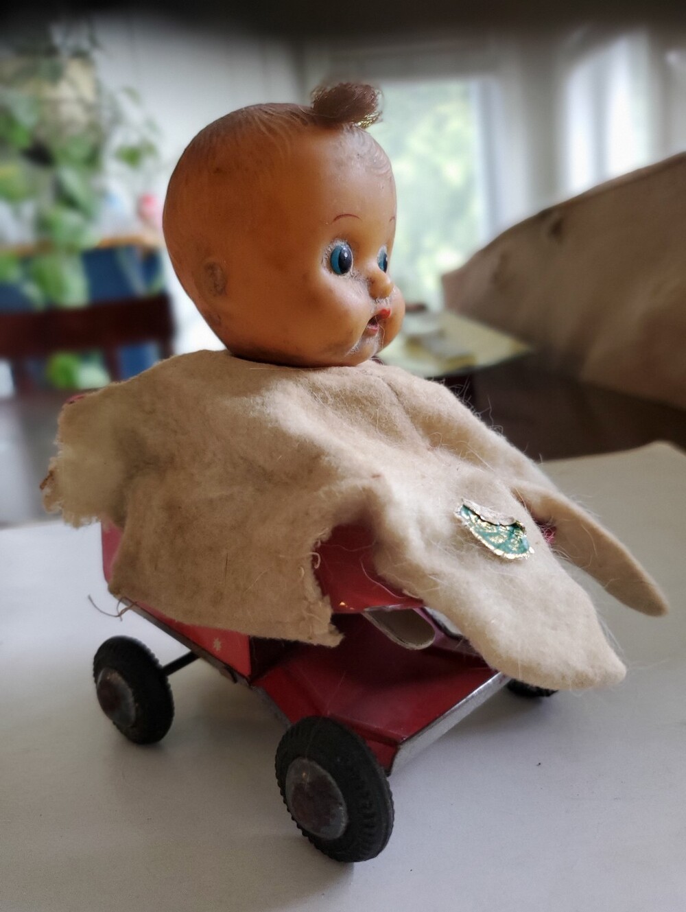 Vintage Red Toy Wagon with Baby Doll and Cream Cape